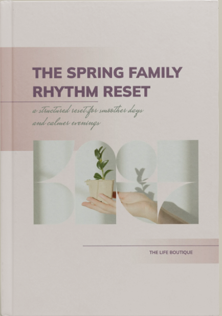 Book titled 'The Spring Family Rhythm Reset' by The Life Boutique on a beige background