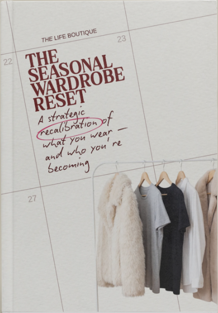 Book titled 'The Seasonal Wardrobe Reset' by The Life Boutique on a beige background