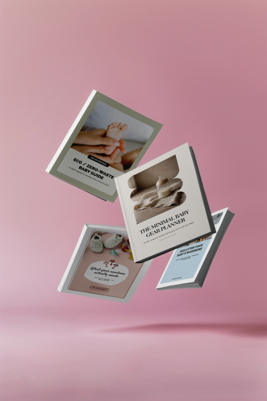Three baby-themed planners floating against a pink background