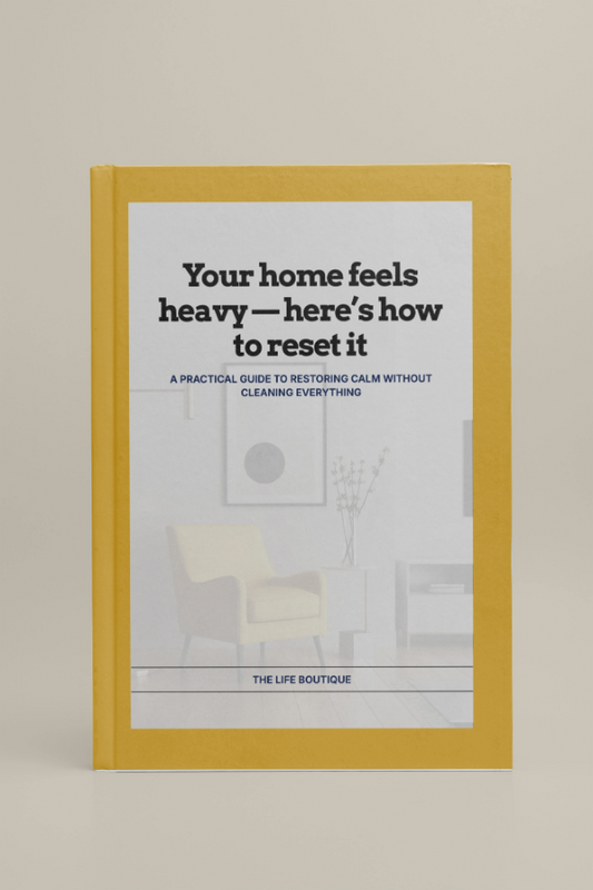 Book titled 'Your home feels heavy - here's how to reset it' with a yellow cover on a beige background
