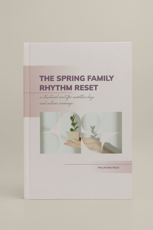 Book titled 'The Spring Family Rhythm Reset' by The Life Boutique on a beige background