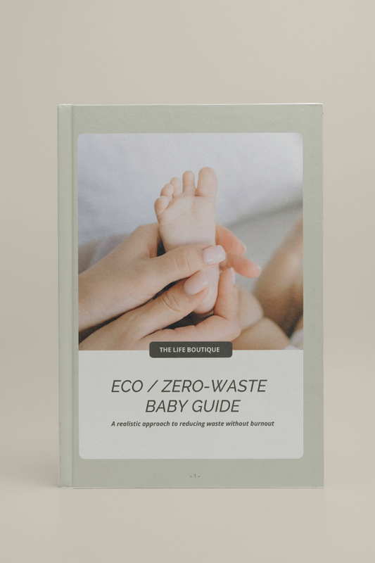 Book titled 'Eco/Zero-Waste Baby Guide' by The Life Boutique on a beige background