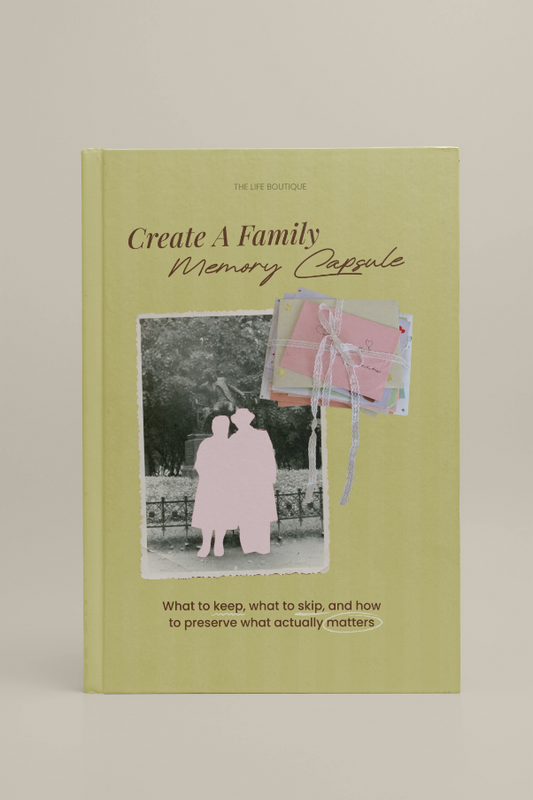 Book titled 'Create A Family Memory Capsule' with a cover featuring two people and a photo album on a beige background.